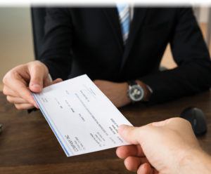 Image of a check changing hands